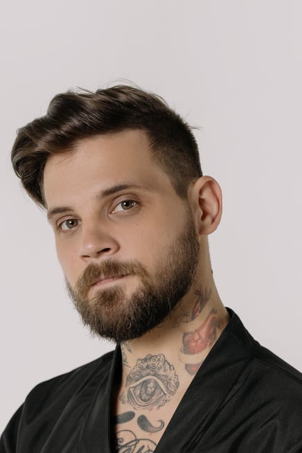 Close-Up Shot of a Bearded Man in Black Shirt